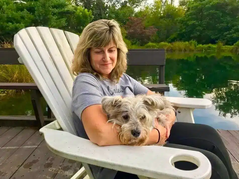 Suzanne holding her dog